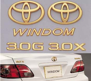 Gold emblem (the Toyota symbol [for front for rear]/car name logograph [for rear]/grademark [for rear])